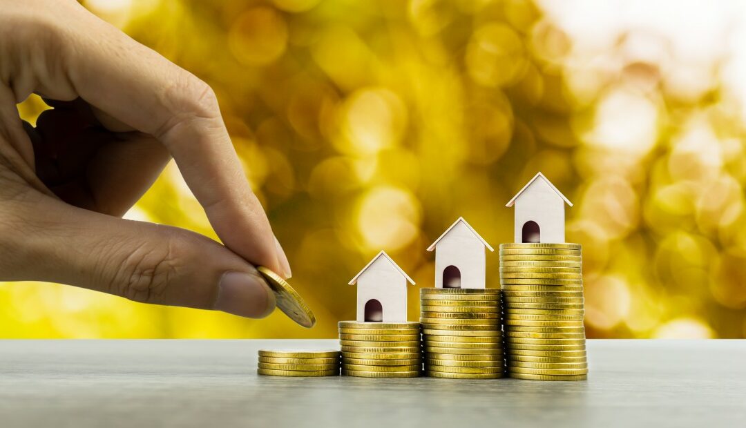 photo of toy houses sitting on top of coins stacked at different levels to show the difference in home equity